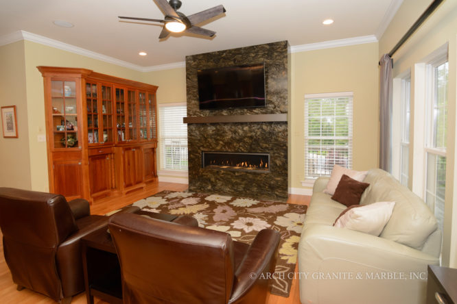 A floor to ceiling Fireplace surround fabricated and installed with Saturnia Schist stone in missouri