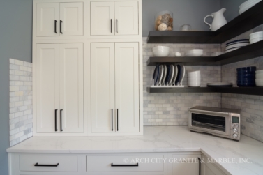 White Quartz Countertops with Marble Tile Backsplash in the st. louis area